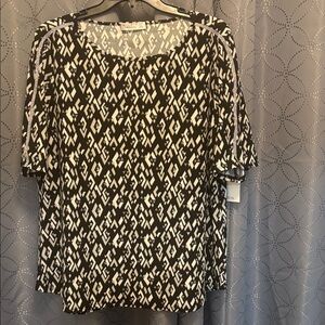 89th + Madison Geometric Black and White blouse with diamond Strip.